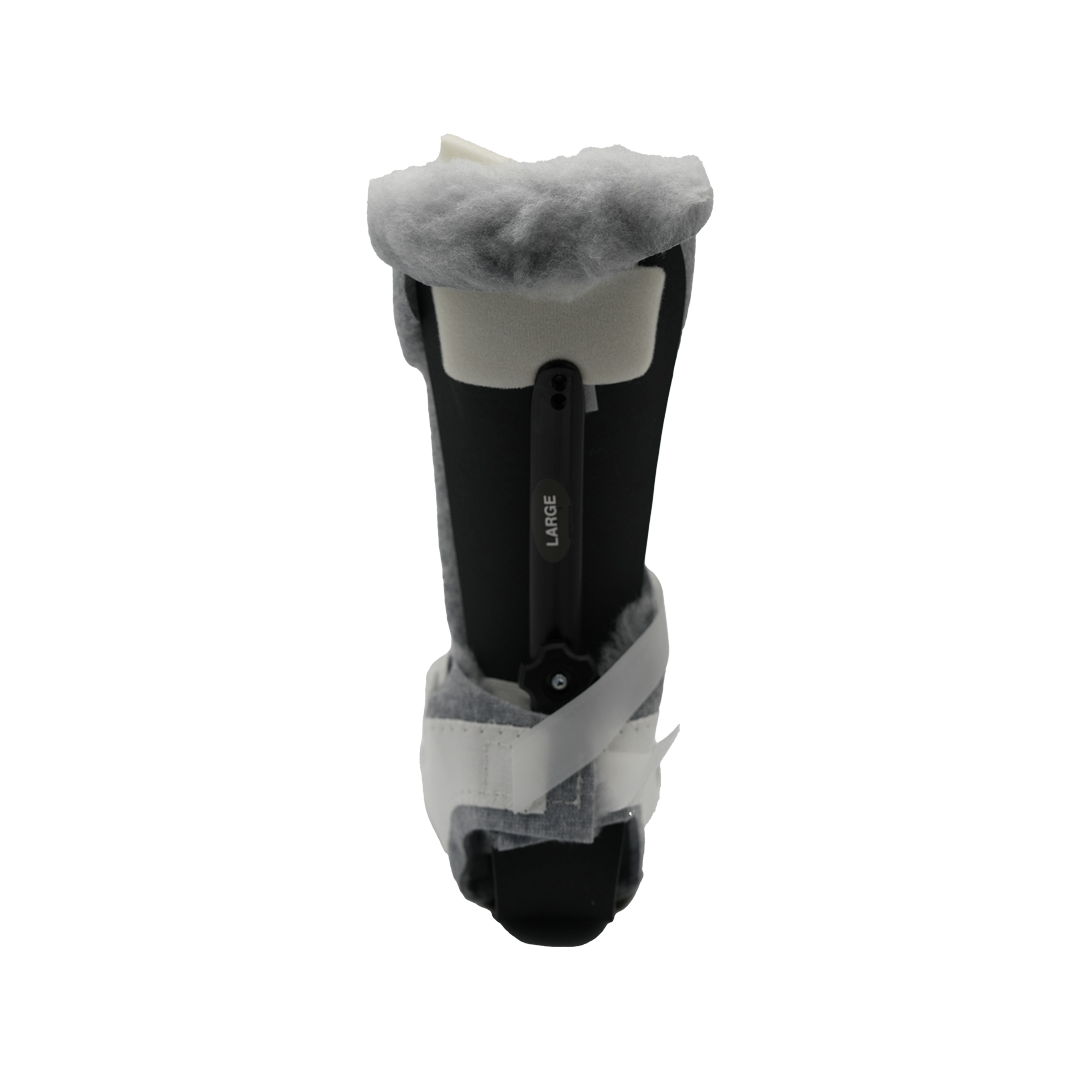 Black orthopedic Multi Podus boot with white straps and soft gray fleece lining.