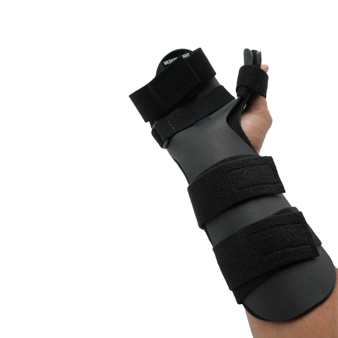 Neutral black hand orthosis with thumb rest and adjustable Velcro straps, worn on left hand.