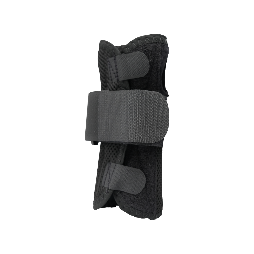 Black ambidextrous wrist brace with Velcro straps and breathable mesh fabric.