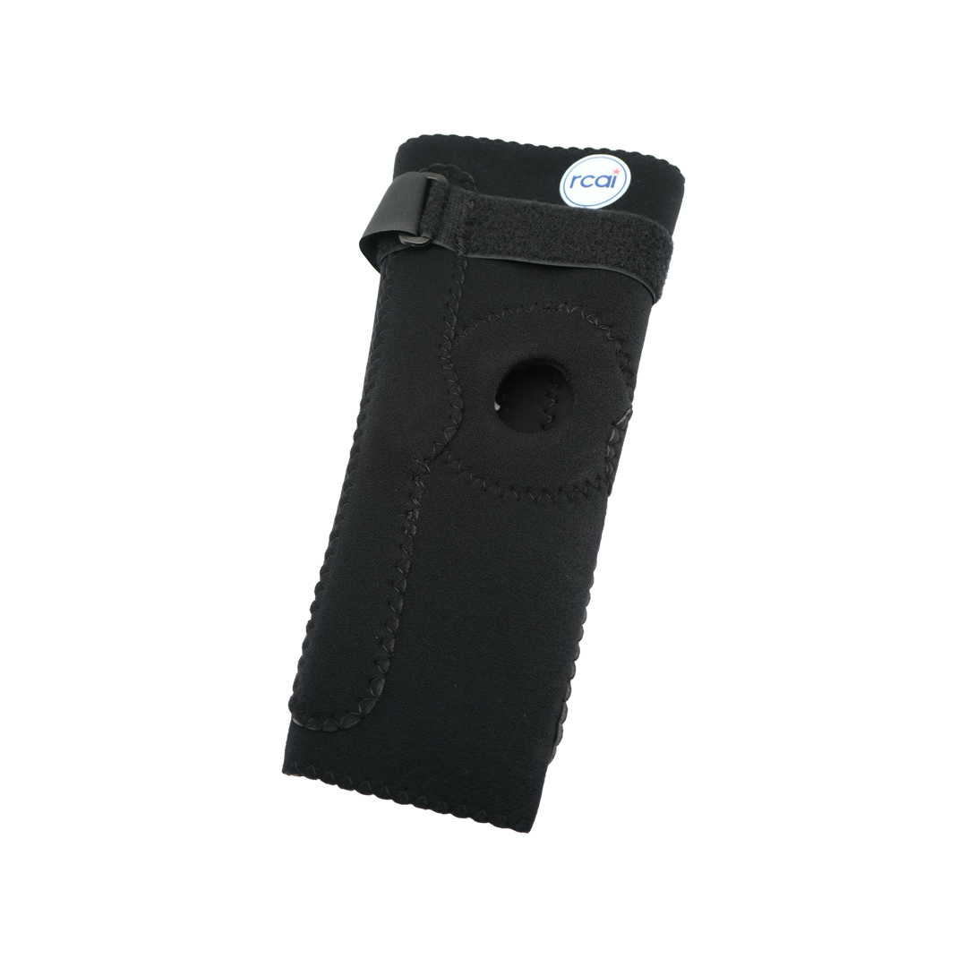 Black hinged elbow sleeve with adjustable strap and circular cutout for elbow joint, RCAI logo tag visible at top edge.