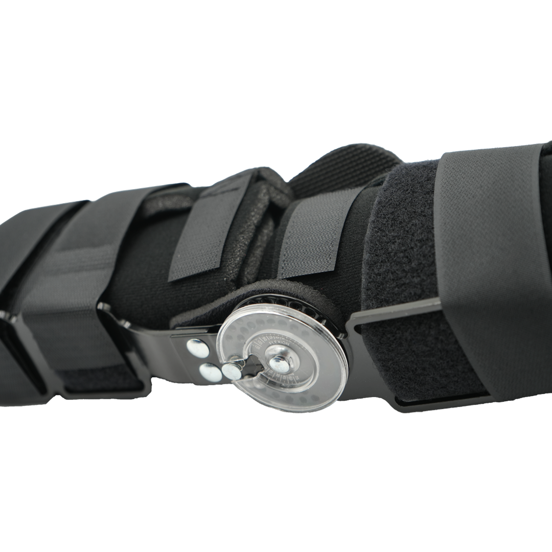 Black semi-rigid knee brace with adjustable ratchet dial and padded straps.