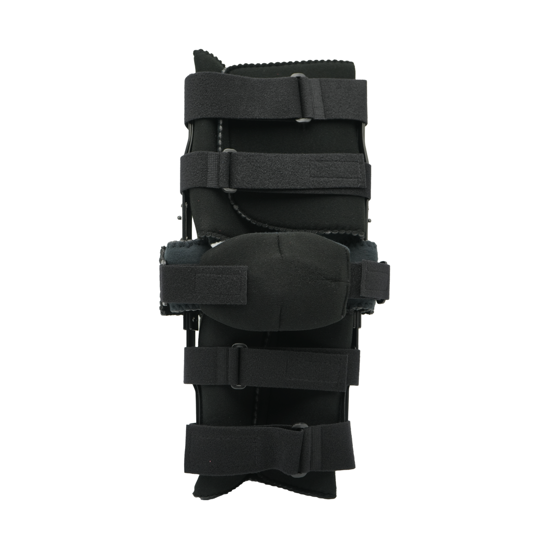 Black adjustable post-operative knee brace with ratchet hinge and multiple Velcro straps.