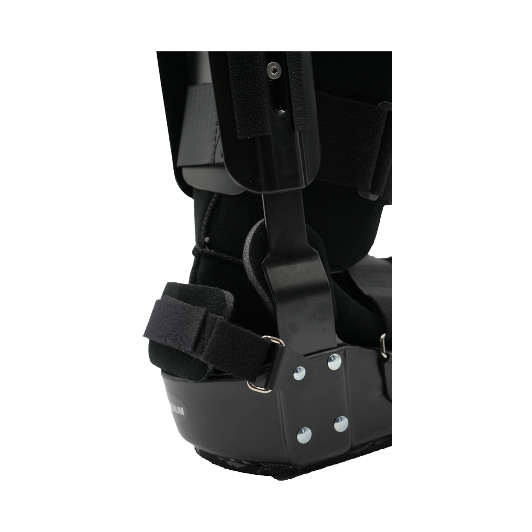 Black lightweight orthopedic recovery boot with adjustable straps and metal support frame on heel and ankle.