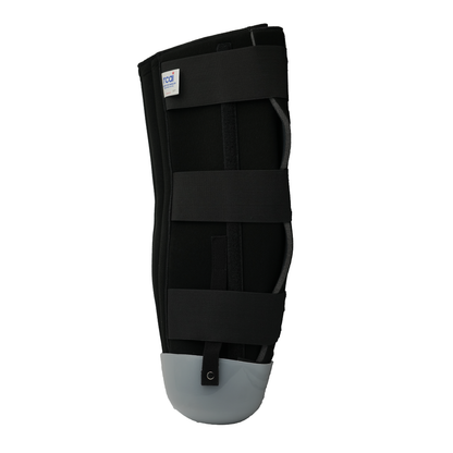 Black below knee rigid dressing protector with three adjustable straps and gray protective toe cap.