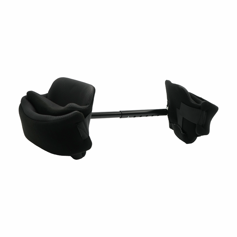 Black padded abduction bar with contoured supports connected by an adjustable metal rod, designed for pediatric use, made in .