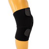 Black wrap-around knee brace with open patella and two gray adjustable hook-and-loop straps, shown on mannequin leg, made in .