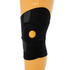 Black wrap-around knee brace with open patella and reinforced buttress, secured by wide Velcro straps, shown on a mannequin.