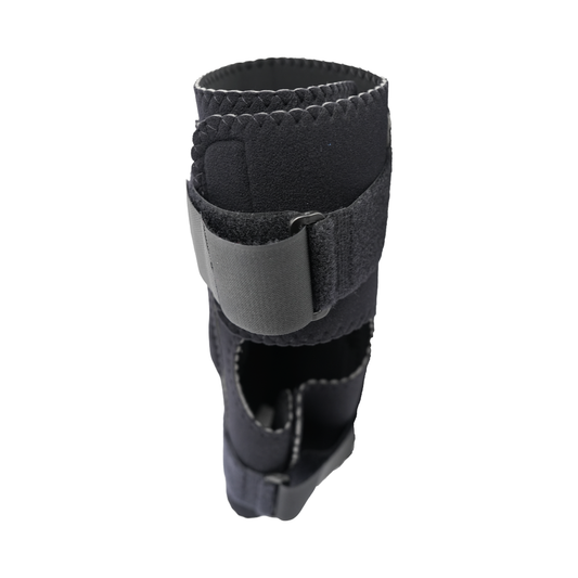 Black neoprene wrap-around knee brace with adjustable Velcro strap and covered side hinge for support.