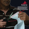 Person cutting white adjustable pediatric abdominal binder material with scissors, highlighting precision cut edge, made in.